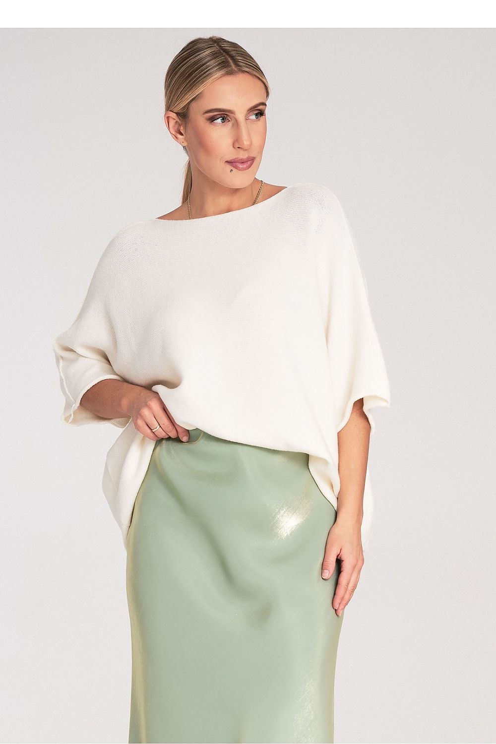 Display of the Figl Bat Style Blouse on a hanger, emphasising its luxurious wool blend fabric and intricate design elements.