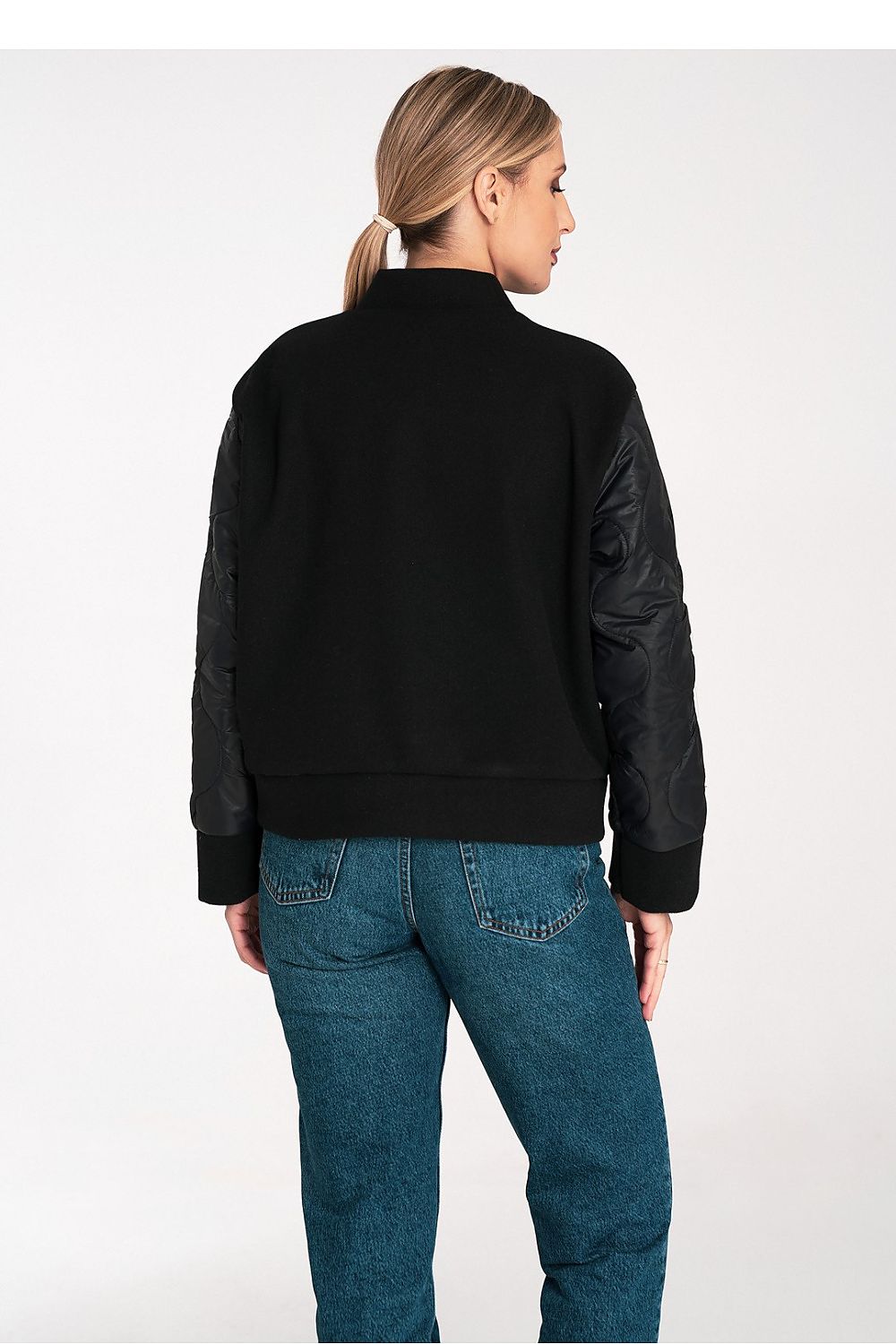 Stylish model wearing the Figl luxury jacket, highlighting its elegant design and comfortable fit in EU S/M and US S/M, perfect for any upscale occasion.