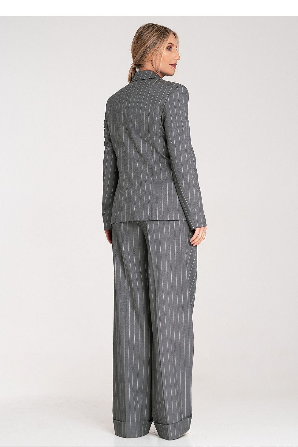 Back view of the Figl jacket, emphasising its sleek design and luxurious fabric drape.