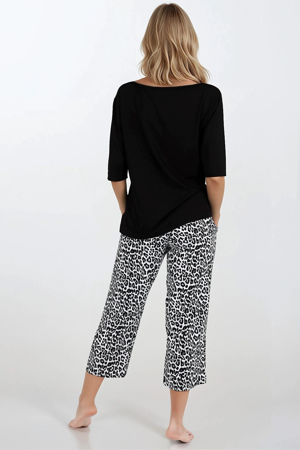 Model wearing luxury sleepwear by Momenti Per Me, displaying the sophisticated stylish look and perfect fit for restful nights.