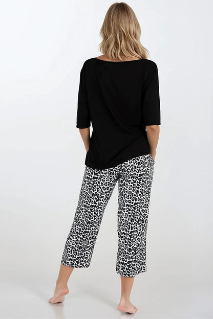 Model wearing luxury sleepwear by Momenti Per Me, displaying the sophisticated stylish look and perfect fit for restful nights.