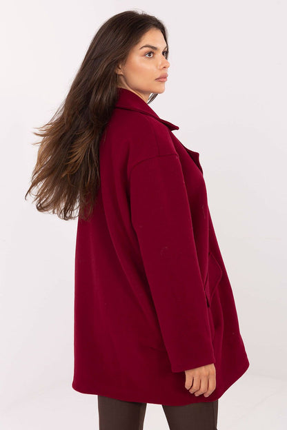 Stylish Rue Paris luxury coat displayed on a hanger, emphasising its sophisticated design and premium quality for discerning fashion lovers.