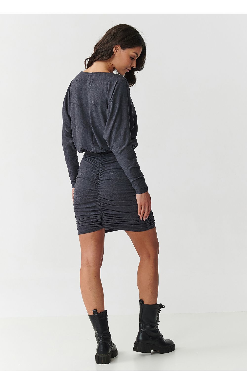 Chic Makadamia Daydress displayed in a beautiful setting, highlighting its sumptuous fabric and sophisticated design, available in EU sizes 36 to 40.