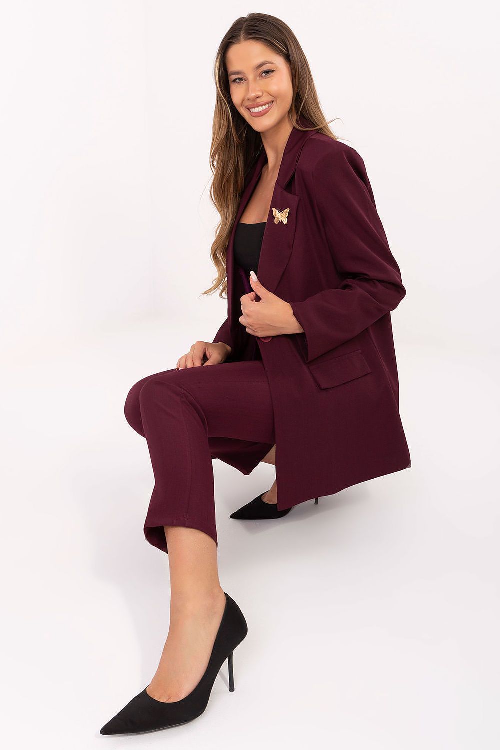 Luxurious elegant women's blazer by Rue Paris featuring shoulder pads and a decorative brooch, perfect for formal and everyday occasions, available in sizes S to XL.