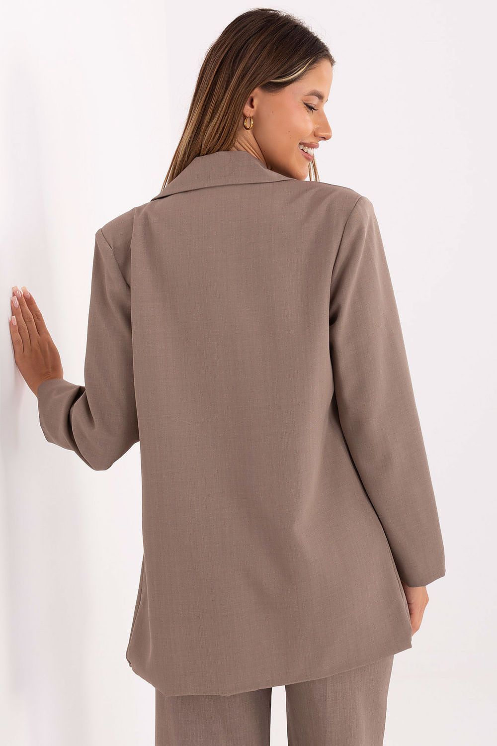 Elegant women's blazer from Rue Paris featuring structured shoulder pads and a decorative brooch, ideal for formal or everyday wear.