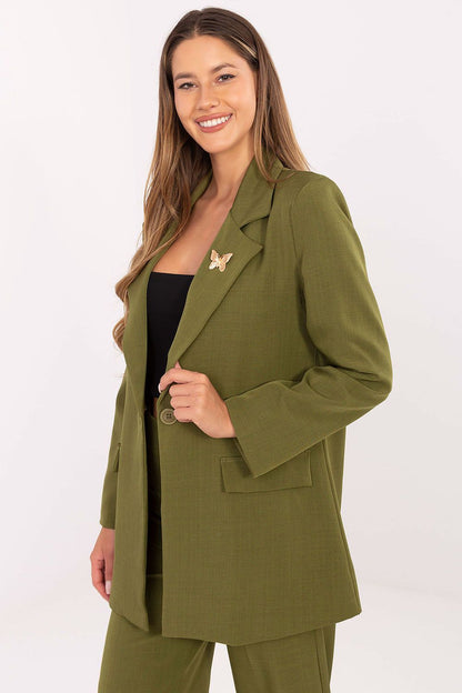 Sophisticated long-sleeve women's blazer by Rue Paris, showcasing a smooth fabric structure, shoulder pads, and a stylish brooch accent.