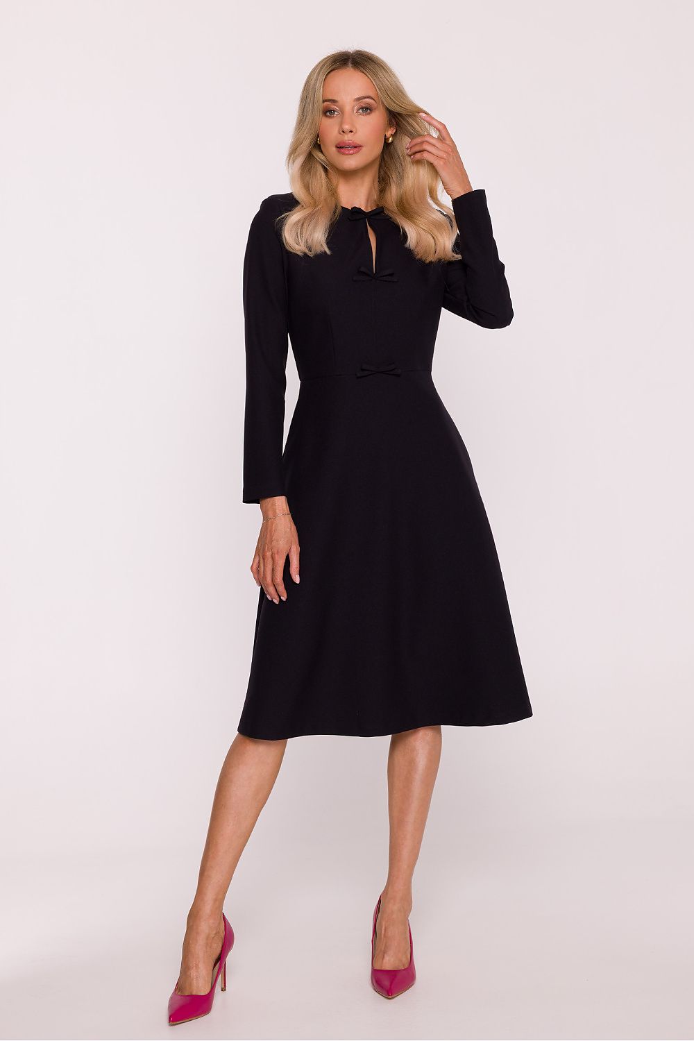 Stylish view of the Stylove daydress showcasing the intricate details of the delicate bows and smooth fabric, epitomising elegance.