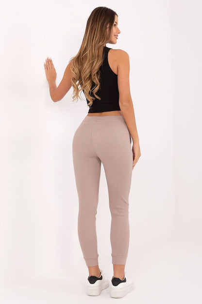 Model wearing Relevance Luxury Cotton Elastane Tapered Tracksuit Trousers, demonstrating a perfect fit and sporty silhouette, ideal for sophisticated casual wear.