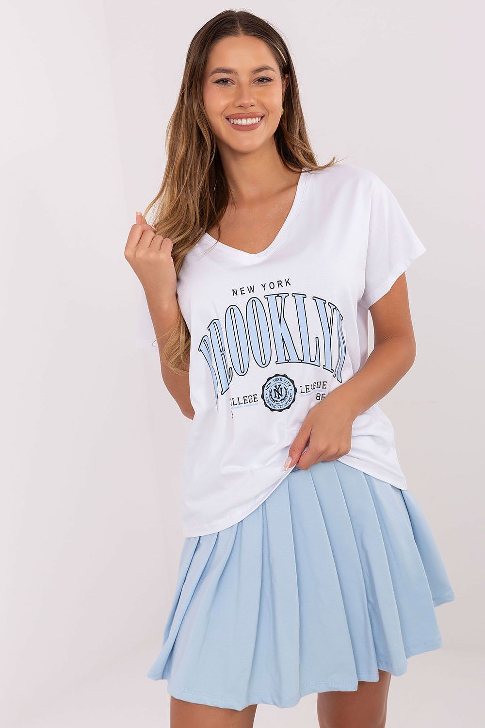 Luxury women's casual t-shirt and pleated mini skirt set by Relevance, showcasing a V-neck design and trendy print, perfect for elevated everyday wear.