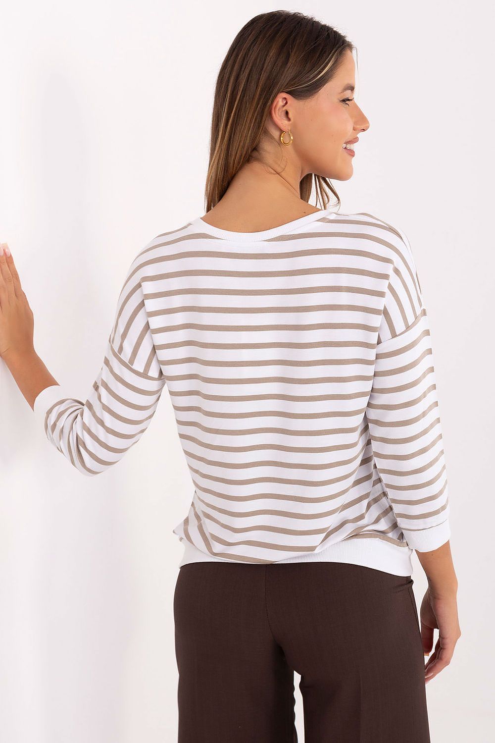 Fashion-forward Relevance casual women's blouse with a flattering silhouette and modern elbow-length sleeves, accented with elegant striped details.