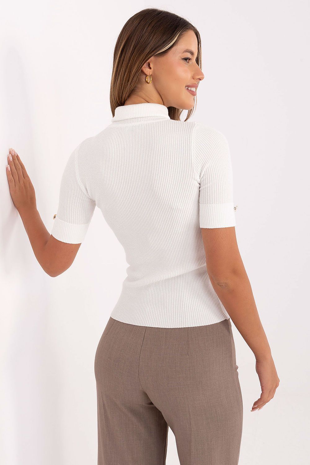 Stylish model wearing an elegant women's turtleneck sweater from Factory Price, ideal for pairing with skirts and tailored trousers.