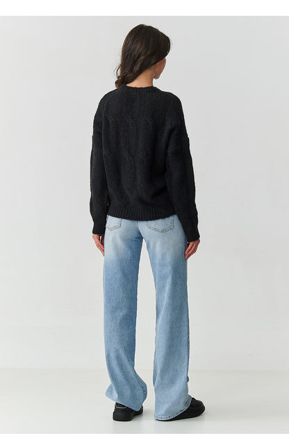 Model wearing Makadamia's soft mohair women's jumper styled with jeans, illustrating versatile fashion and classic elegance.