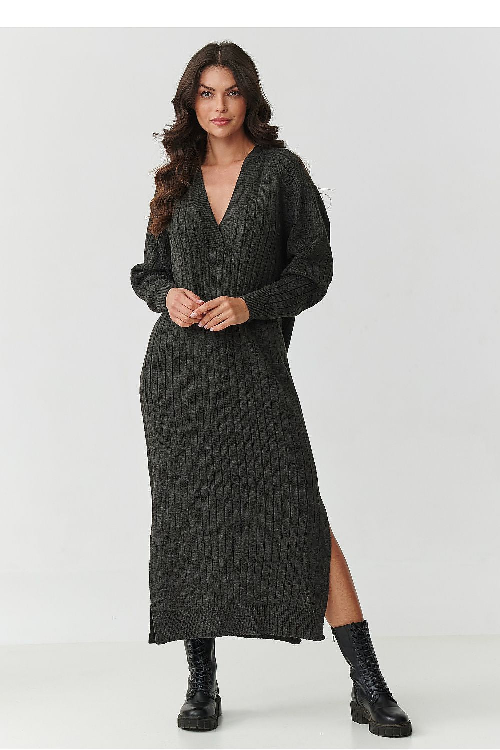 Chic visual of Makadamia's Long Sweater Dress, highlighting its comfortable loose fit and sophisticated side slits for graceful movement.