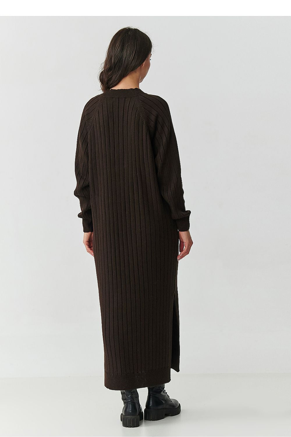 Stylish lifestyle shot of the Makadamia Long Sweater Dress, paired with ankle boots, illustrating its perfect blend of elegance and comfort for any occasion.