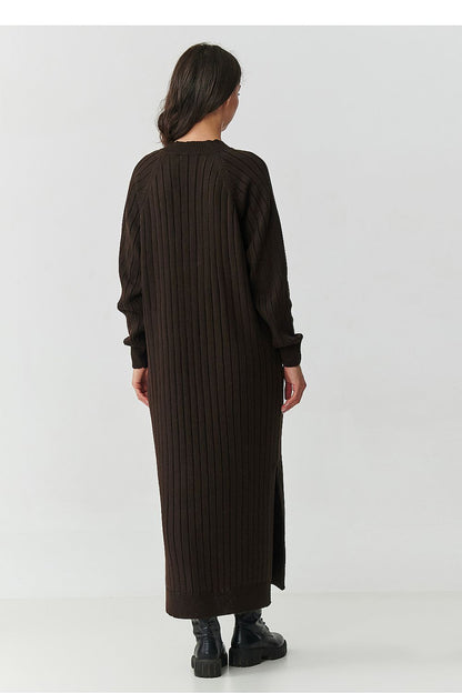 Stylish lifestyle shot of the Makadamia Long Sweater Dress, paired with ankle boots, illustrating its perfect blend of elegance and comfort for any occasion.
