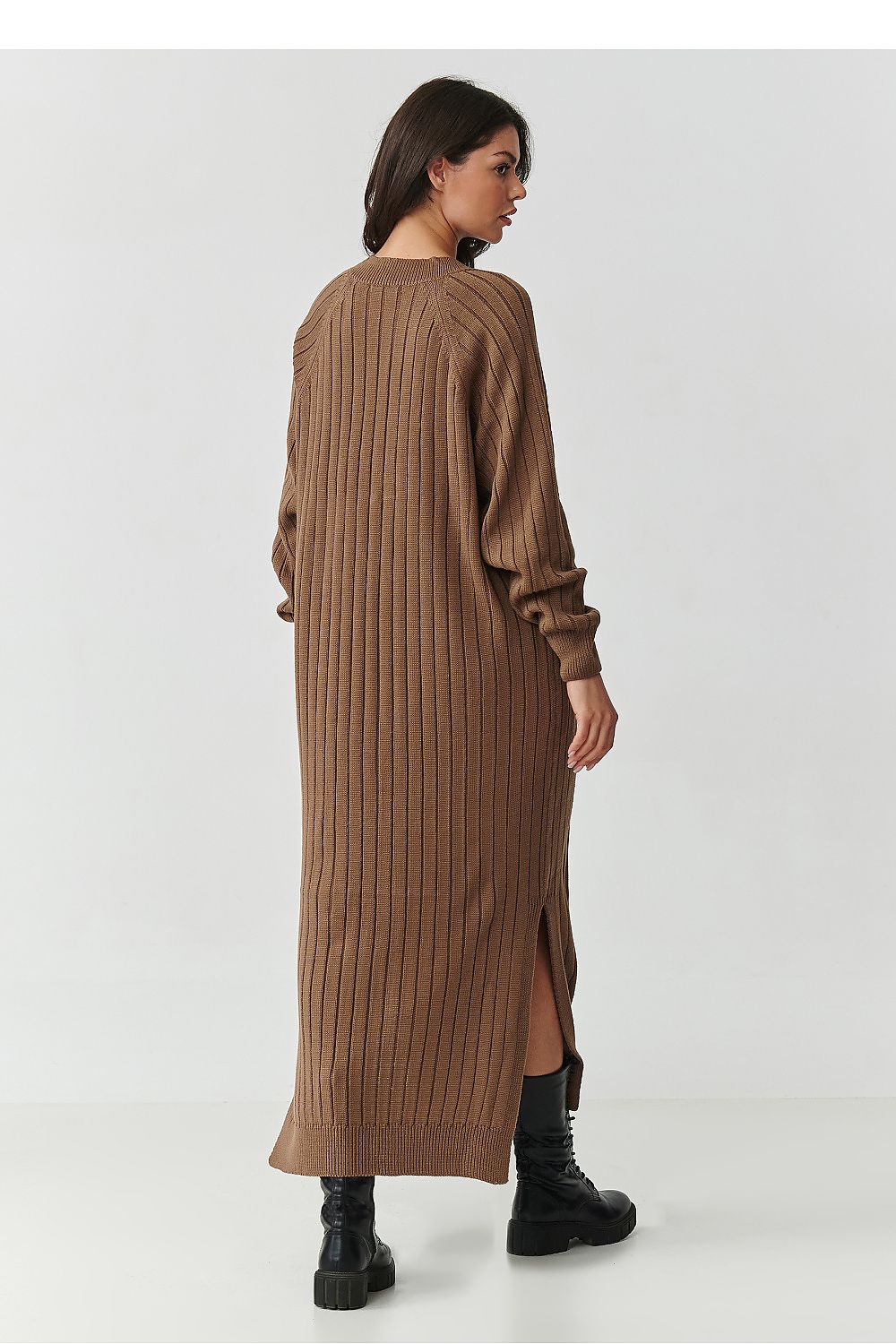 Close-up view of the soft and luxurious ribbed knit fabric of the Makadamia Long Sweater Dress, showcasing its high-quality acrylic composition.