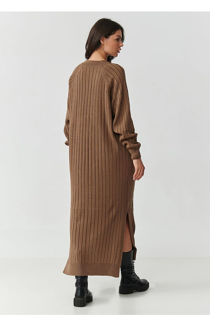 Close-up view of the soft and luxurious ribbed knit fabric of the Makadamia Long Sweater Dress, showcasing its high-quality acrylic composition.