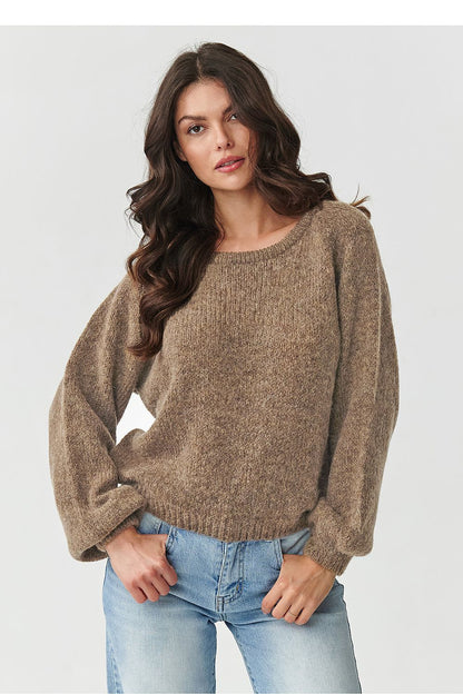 Elegant Makadamia women's jumper draped on a mannequin, highlighting versatile styling options and warm colour palette.