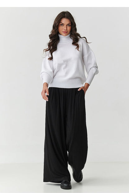 Close-up of the luxurious fabric of Makadamia's Women's Oversized Turtleneck Sweater, highlighting its softness and high-quality materials.