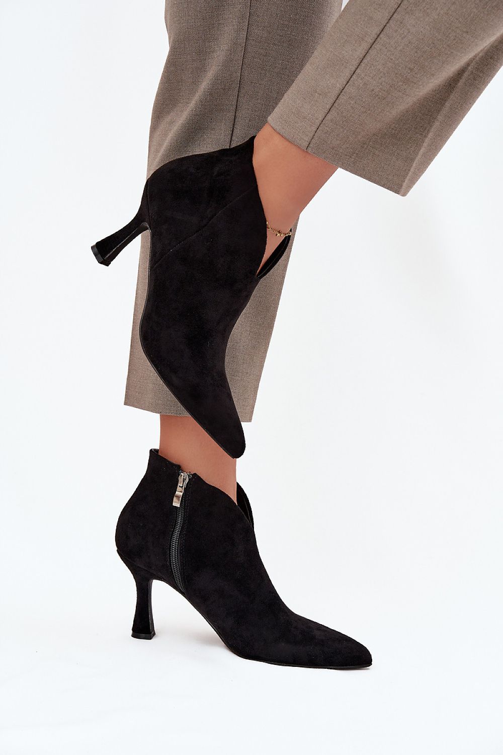 Elegant eco suede ankle heel boots with asymmetrical shaft by Step in Style, showcasing a chic pointed toe and slender stiletto heel.