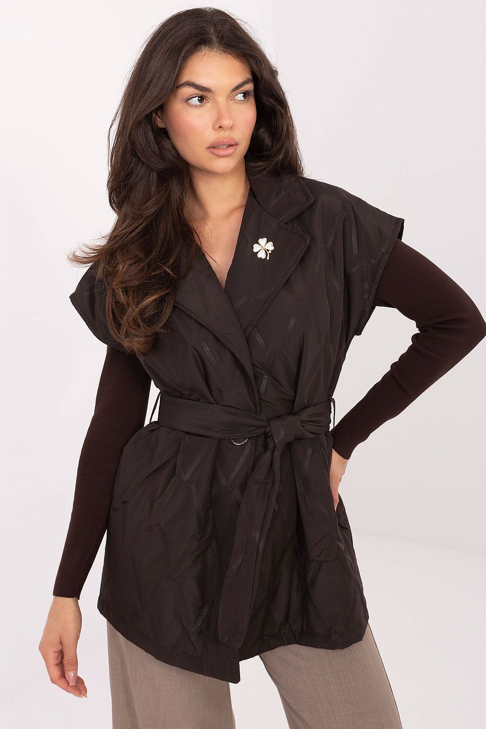 Elegant women's quilted gilet vest by Rue Paris featuring classic lapels, a tie belt, and pockets, perfect for autumn style.