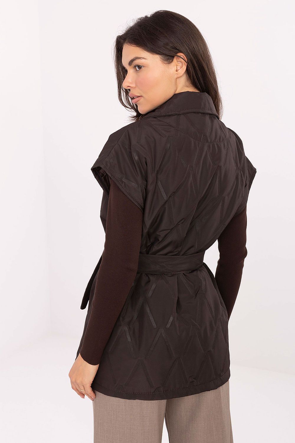 Elegant quilted women's gilet vest with classic lapels and tie belt, designed by Rue Paris, showcasing timeless autumn style.