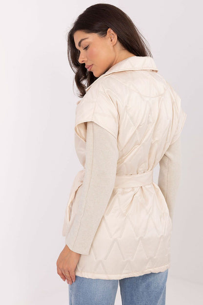 Rue Paris classic quilted women's gilet vest displayed with pockets and tie belt, a versatile autumn wardrobe essential.