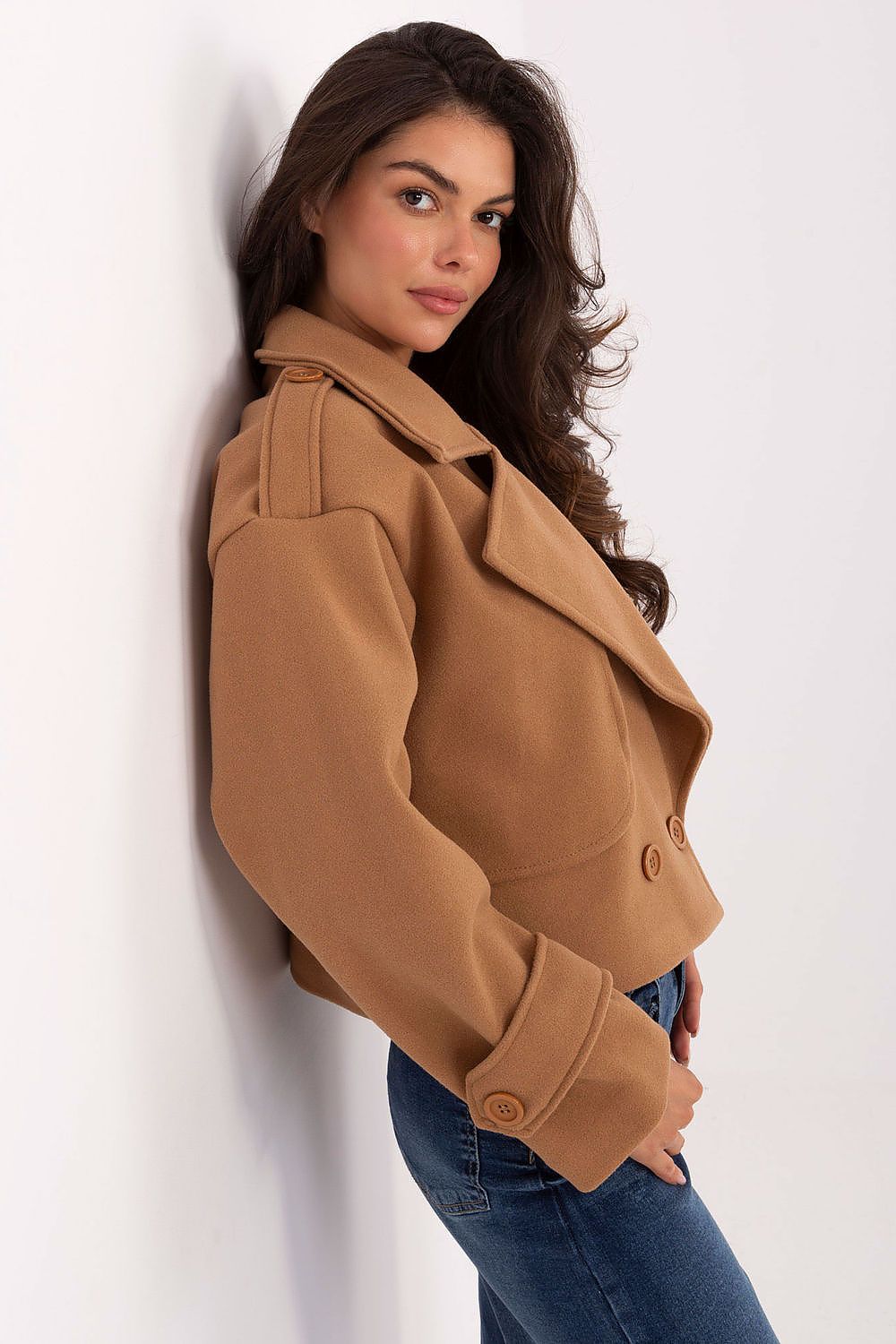 Luxury eco-leather trench coat by Rue Paris displayed on a stylish hanger, emphasizing its smooth texture and chic design for women's fashion.
