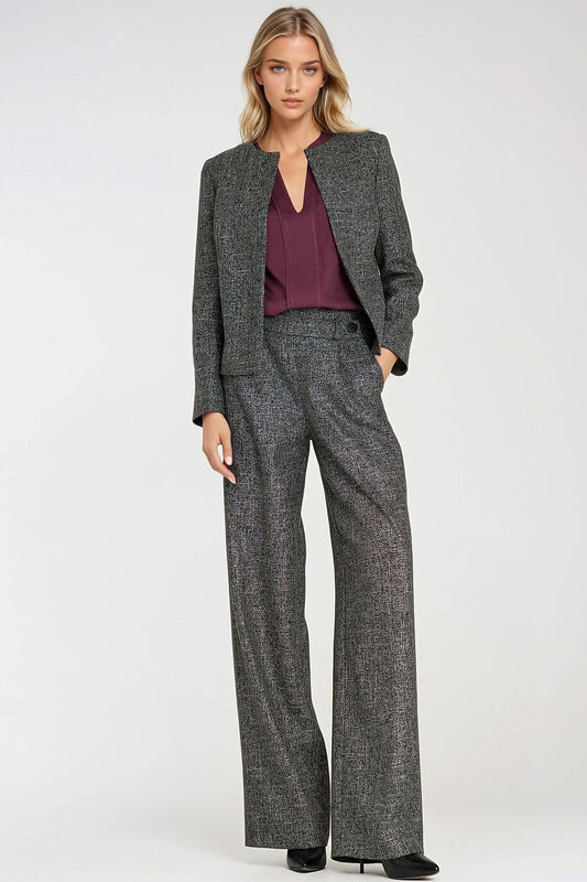 Stylish boxy jacket for women by Nife, showcasing a minimalist design with shoulder pads and luxurious melange fabric.