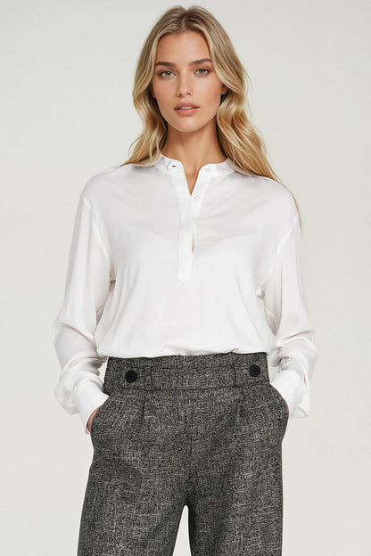 Elegant oversized polo neck blouse by Nife crafted from 100% viscose. Features a stand-up collar and long sleeves, perfect for both smart casual and office styles, available in sizes EU 36-42.