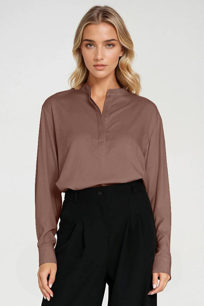 Flat lay of Nife's elegant oversized blouse in timeless neutral colour, highlighting its classic silhouette and premium viscose material, perfect for modern luxury fashion.