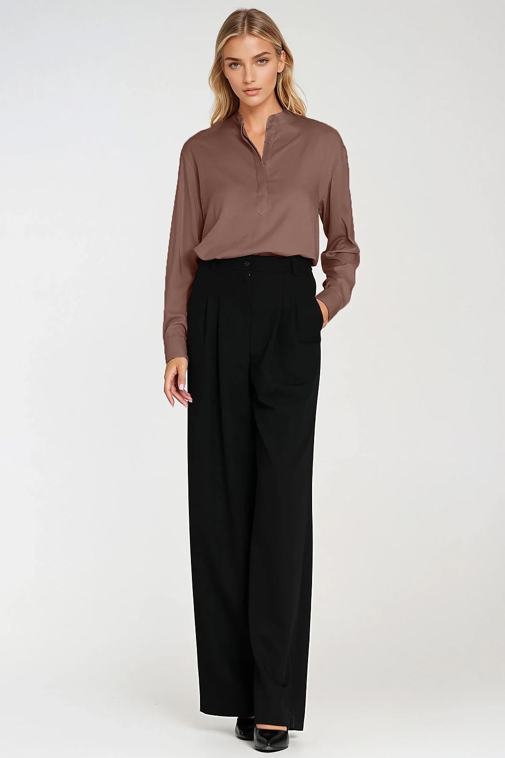 Detail shot of the cuffs and collar of Nife's oversized blouse, emphasizing its elegant craftsmanship and stylish design for sophisticated women's fashion.