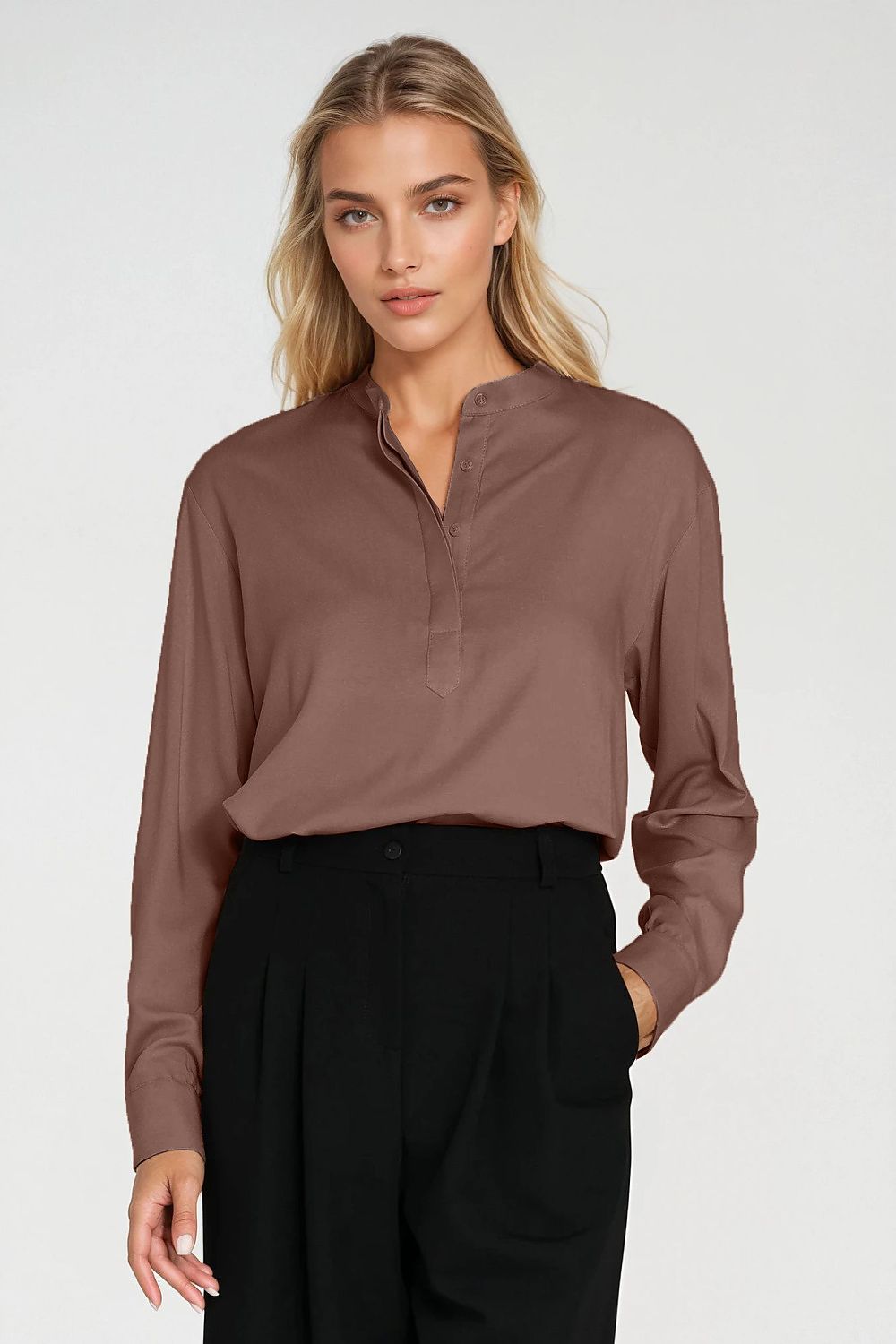 Nife's modern oversized blouse in viscose, featuring a minimalist halfway button closure and chic cuffs, ideal for office and smart casual occasions, available in sizes EU 36-42.
