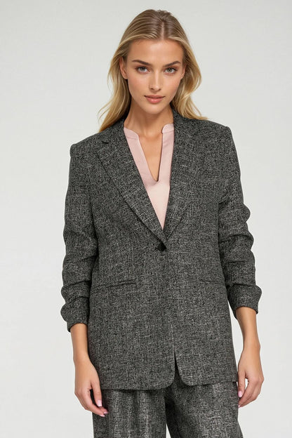 Stylish melange texture women's jacket with shoulder pads by Nife, designed for a sophisticated silhouette.