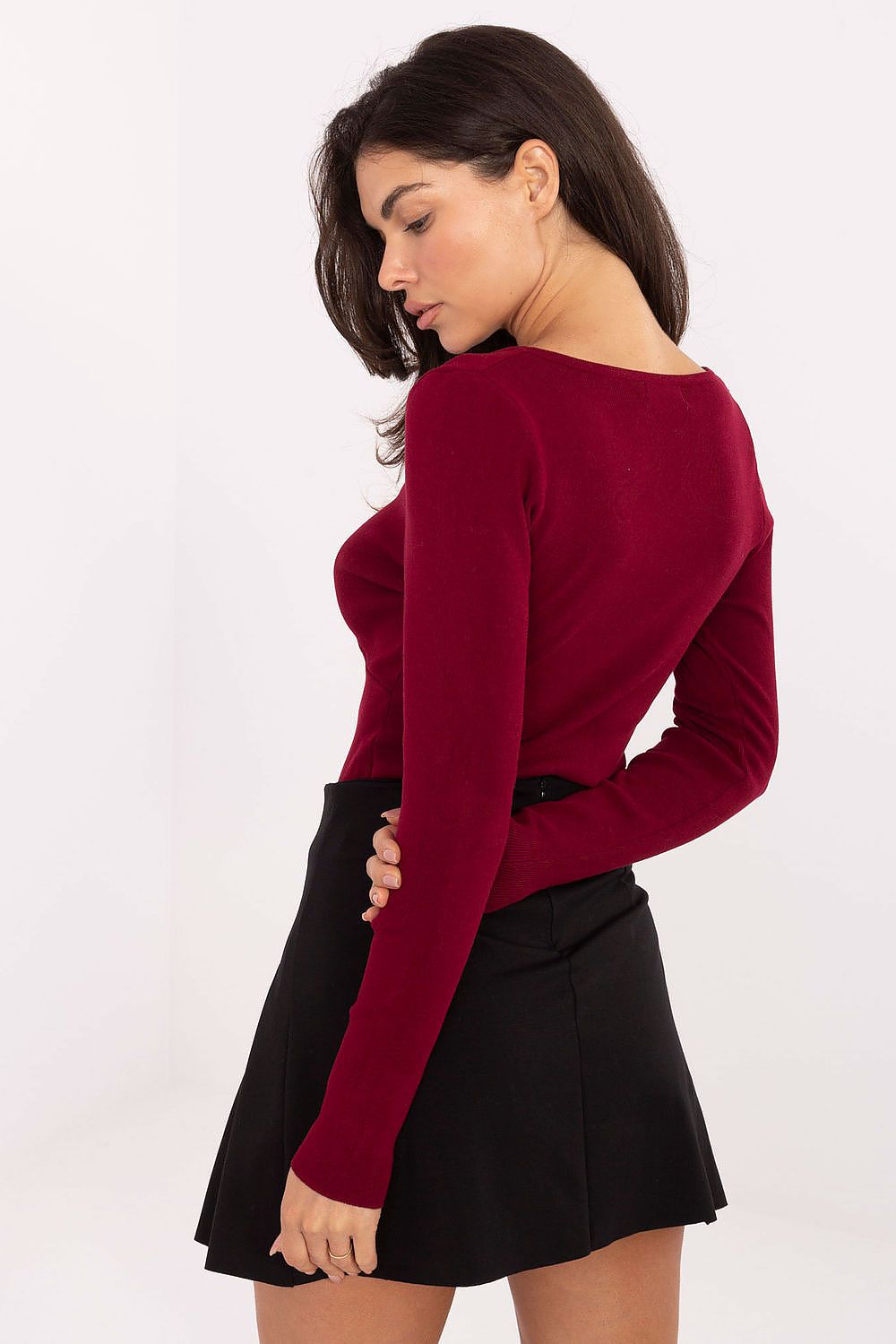 Model wearing the elegant women's V-neck sweater in a chic outfit, highlighted as a versatile choice from Factory Price for everyday and formal occasions.