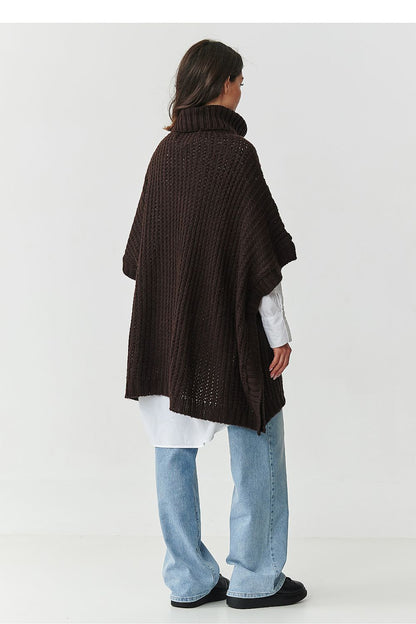 Chic chocolate poncho turtleneck sweater from Makadamia, showcasing ribbed finishing and ample front pockets, perfect for stylish and warm outfits.