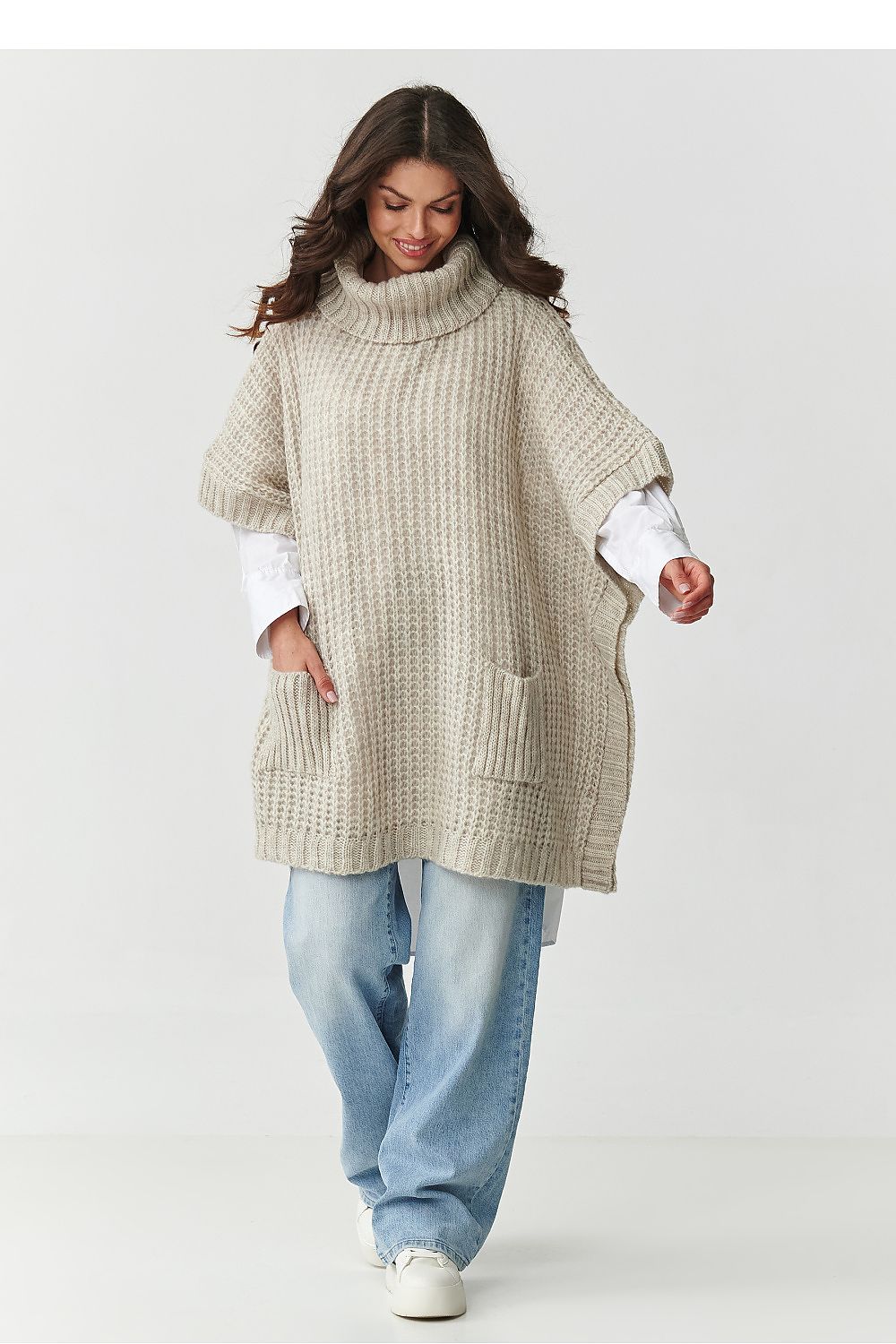 Elegant poncho-style turtleneck sweater by Makadamia with elbow-length sleeves, crafted from high-quality fibers for warmth and softness, showcased in rich bottle green.
