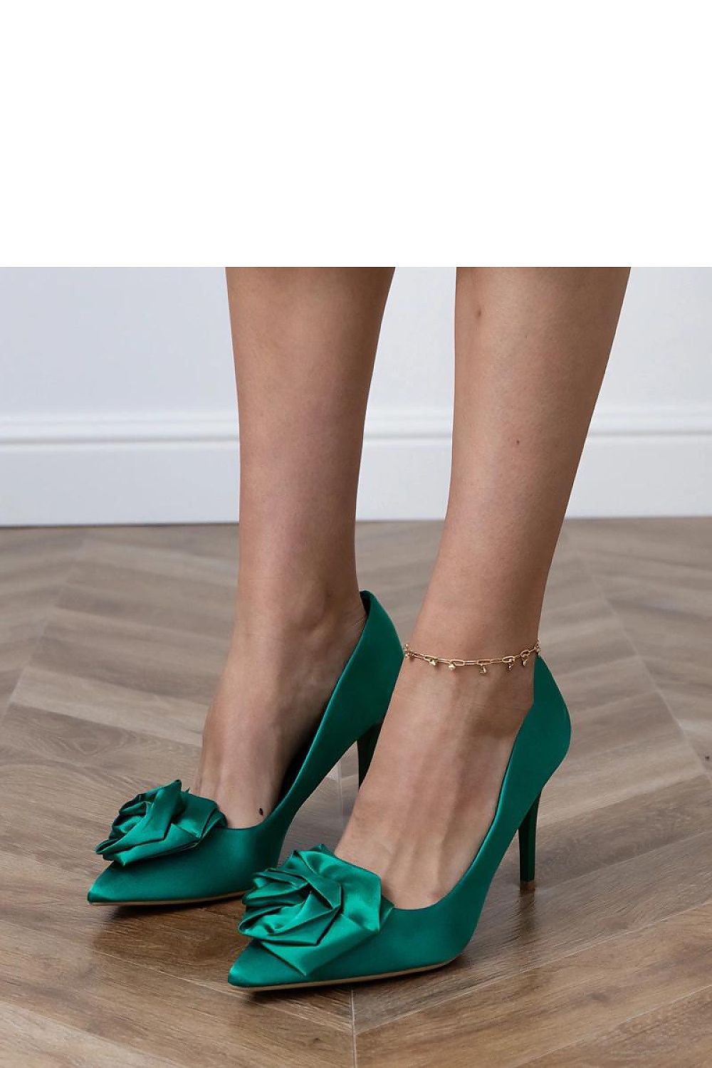 Solea's exquisite satin pumps with floral embellishments and pointed toe design, ideal for special occasions and parties.