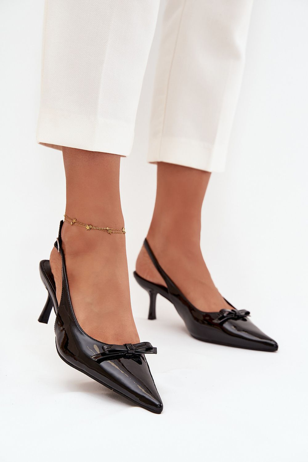 Elegant eco-leather stiletto heel pumps from Step in Style, featuring an adjustable strap and a feminine bow for sophisticated flair.