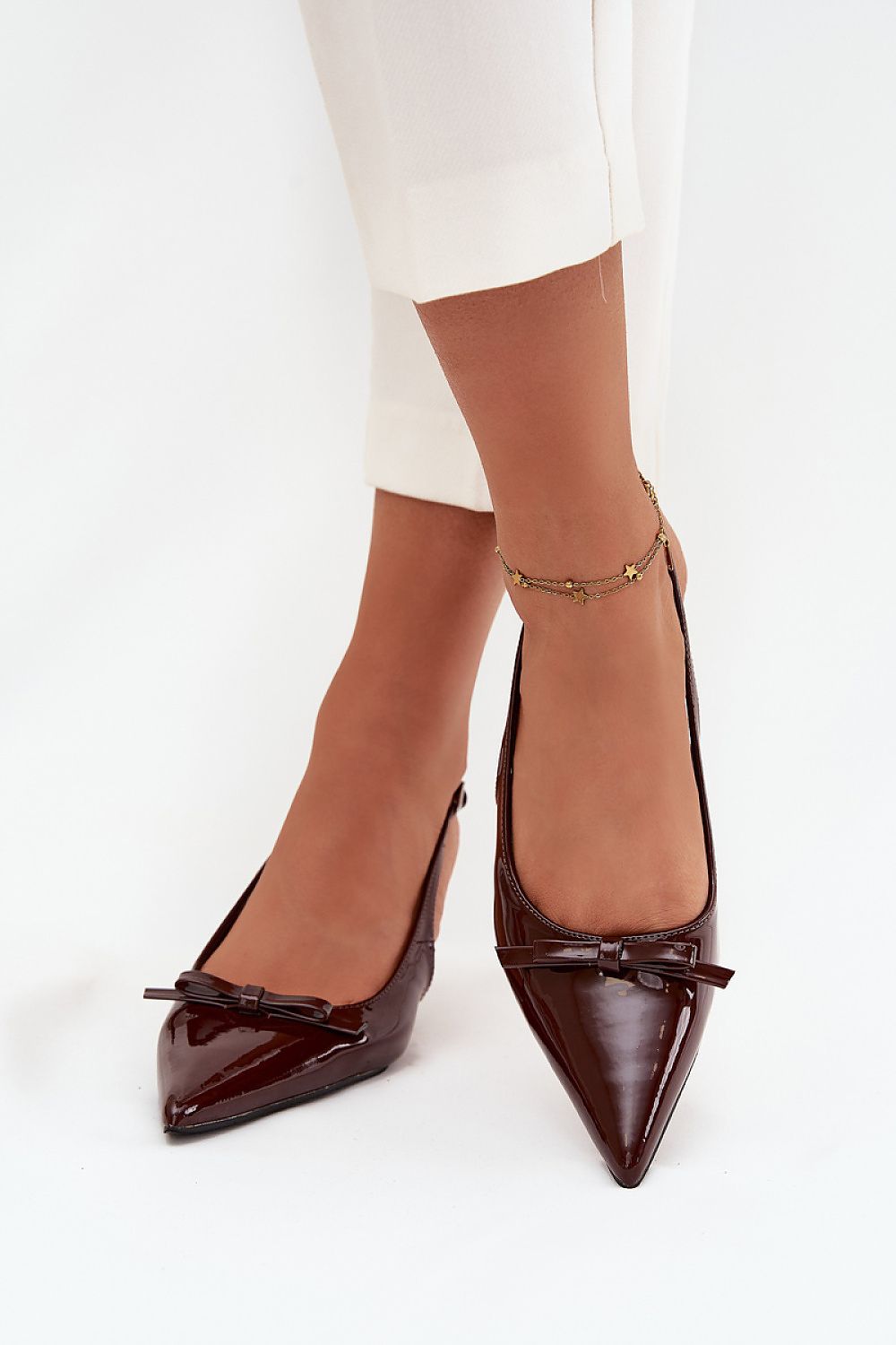 Luxury pointed toe pumps in eco-leather by Step in Style, showcasing a slender stiletto heel and charming bow detail, ideal for elevating elegant ensembles.