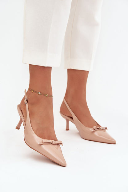 Luxurious eco-leather heel pumps with a slender stiletto by Step in Style, featuring an adjustable strap and a charming bow detail, perfect for elegant occasions.