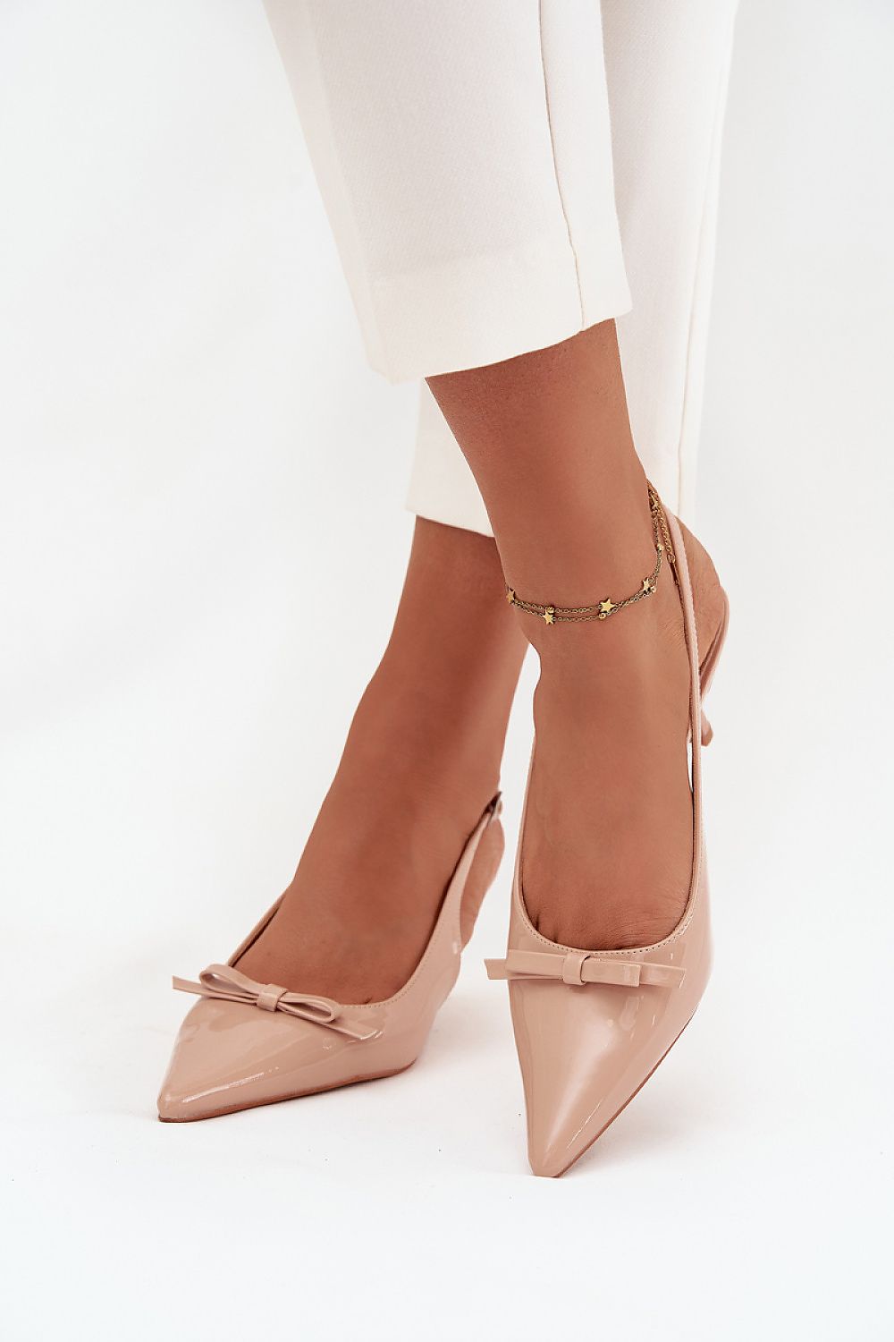 Elegant women's pumps from Step in Style, crafted in eco-leather with an adjustable buckle strap and pointed toes, adding a refined touch to formal attire.