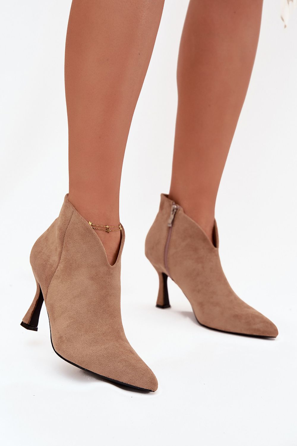 Fashion-forward ankle boots made of eco suede with unique asymmetrical design, perfect for elegant occasions by Step in Style.