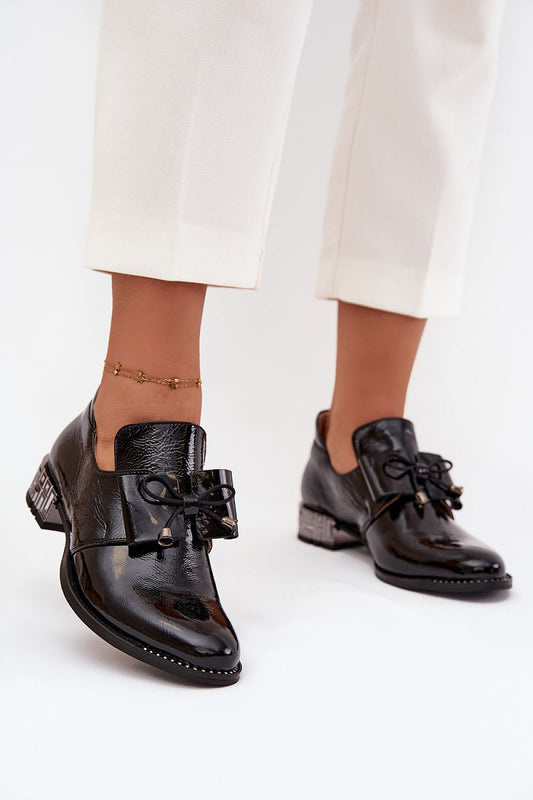 Elegant women's low heeled slip-on shoes crafted from natural leather featuring a stylish bow detail, designed by Step in Style, perfect for both everyday wear and special occasions.