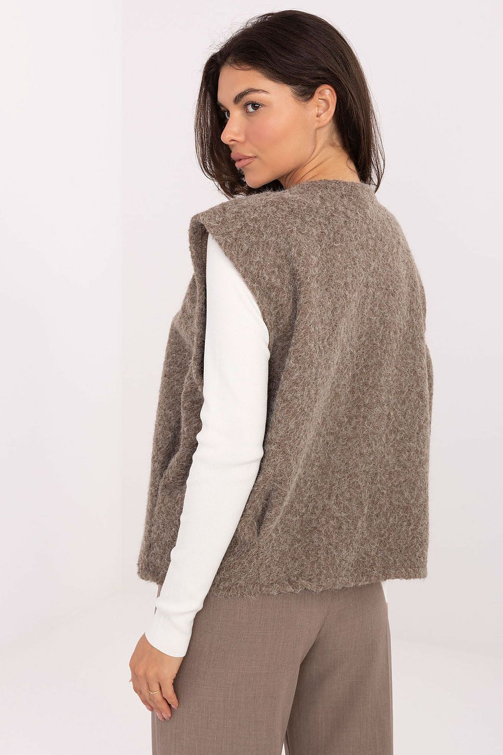 Fashionable Rue Paris boucle vest worn in an everyday outfit, embodying casual elegance for women this seasonal trend.