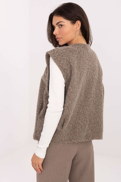 Fashionable Rue Paris boucle vest worn in an everyday outfit, embodying casual elegance for women this seasonal trend.