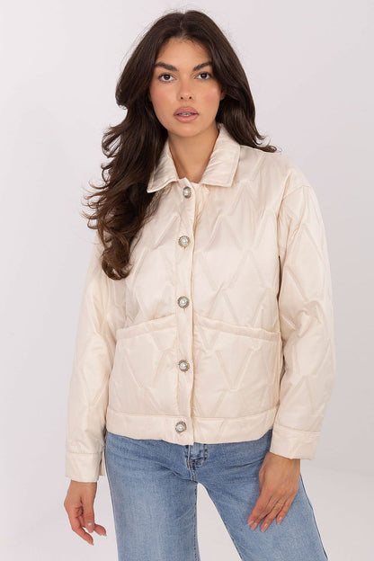 Back view of Rue Paris women's transitional quilted jacket, illustrating its standard length and timeless button closure.