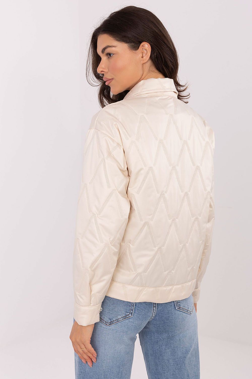 Elegant Women's Quilted Jacket by Rue Paris showcasing its sophisticated design and unique texture, ideal for transitional seasons.