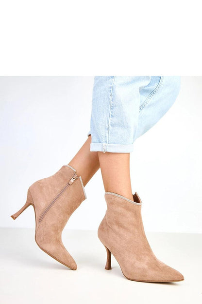Close-up of Solea's elegant ankle boots showcasing unique zircon embellishments, designed for comfort and style in transitional seasons.