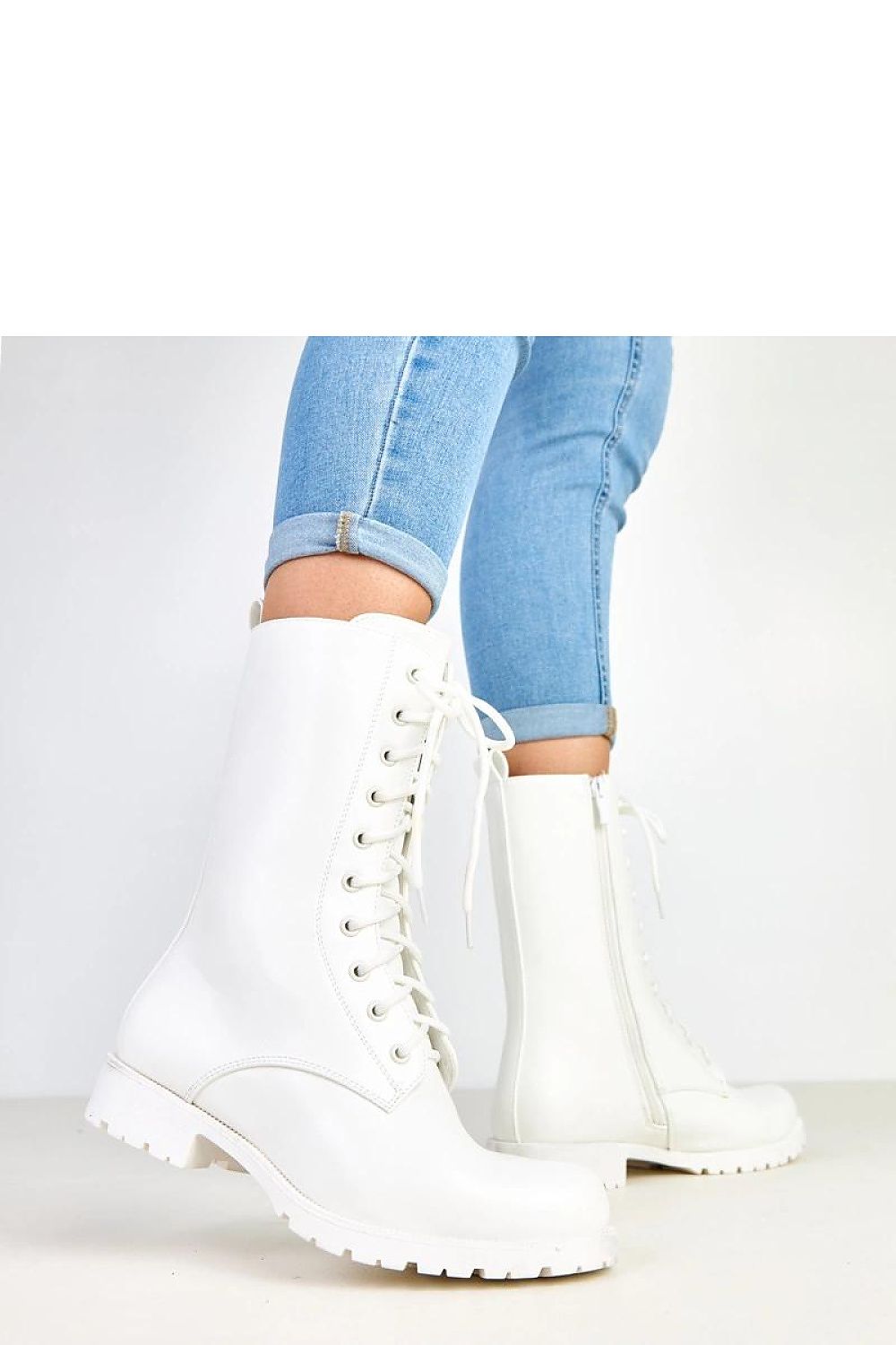 Solea Women's white work boots styled with urban outfits, highlighting versatile fashion for casual and professional looks.